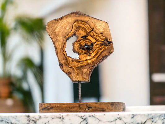 Handcrafted olive wood sculpture by OliveArt, natural wooden home décor ornament with intricate grain and smooth finish.
