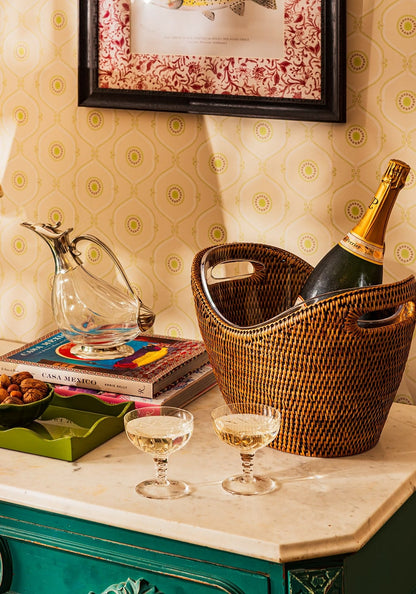 Jane's woven rattan wine and champagne bucket from Casa by Josephine Jenno, designed for stylish barware and beverage chilling.