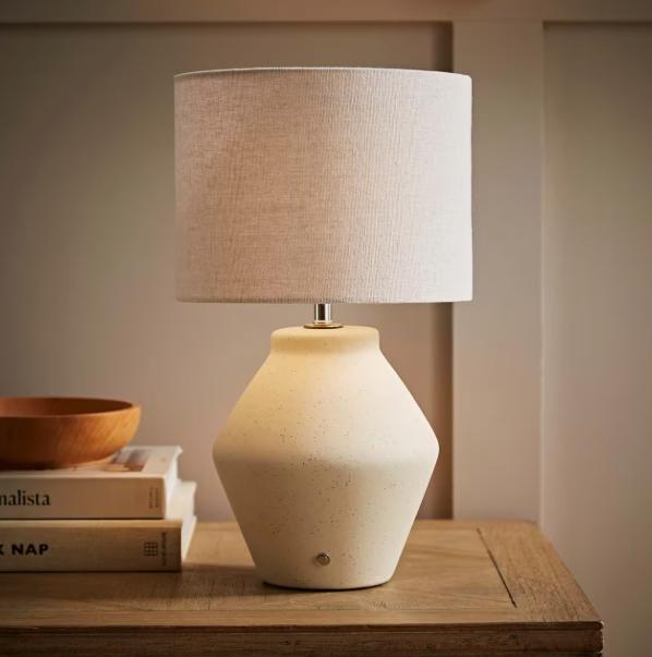 Finn ceramic rechargeable table lamp by TrendHomeDepot, portable wireless lamp with ambient lighting, shown in a modern living space.