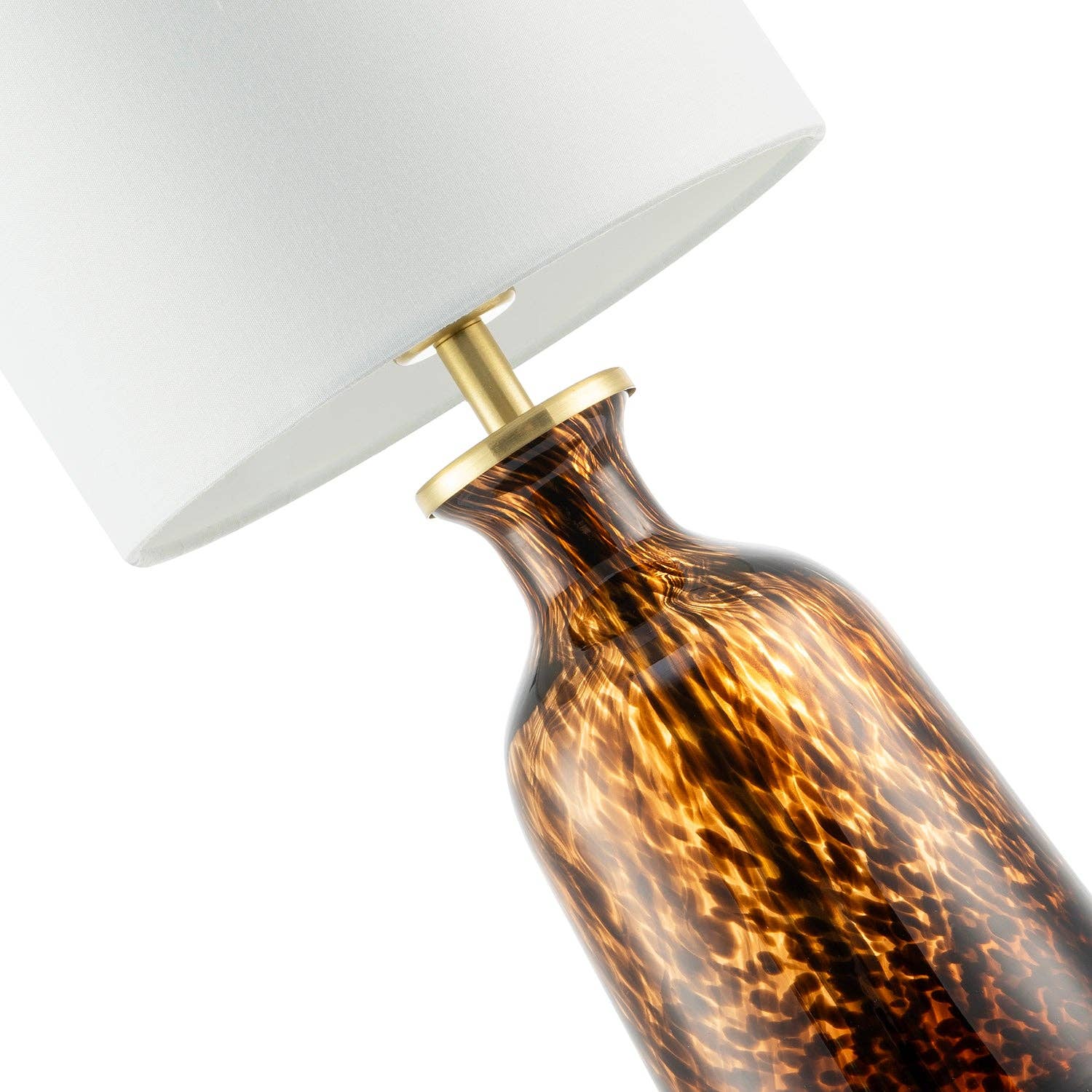 Modern amber and black snowflake speckle glass table lamp with shade, featuring intricate design and elegant lighting.