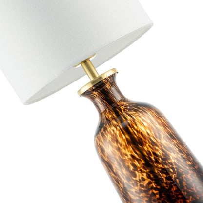Modern amber and black snowflake speckle glass table lamp with shade, featuring intricate design and elegant lighting.
