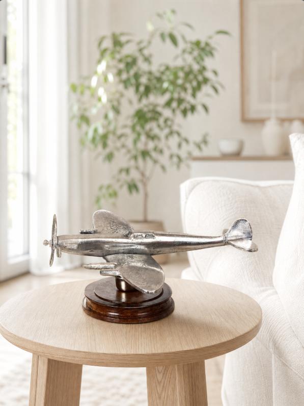 Vintage Spitfire model ornament by Maravi featuring a metal airplane on a wooden base, detailed and decorative for display.