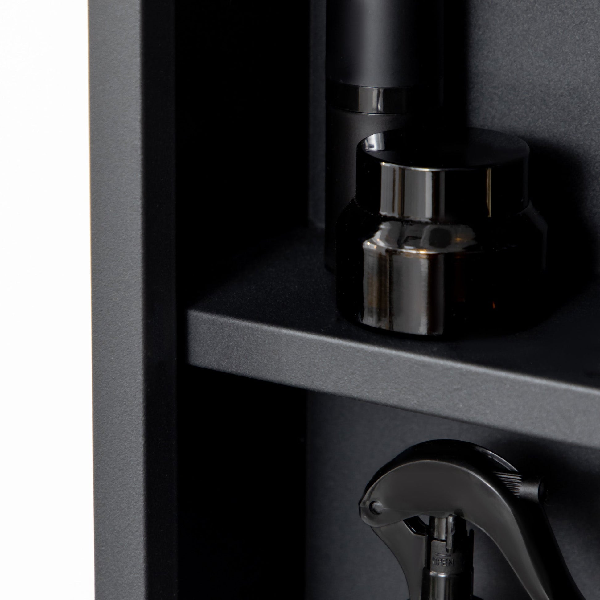 Wall-mounted black bathroom mirror cabinet with storage shelves, featuring a reflective mirror surface and compact design.