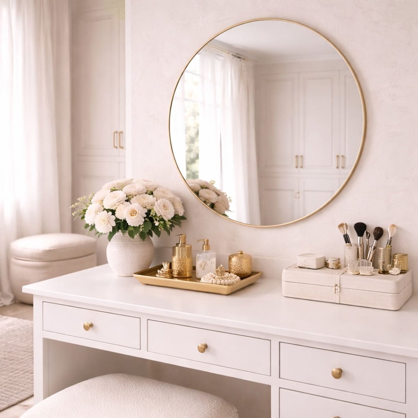 Round gold metal circle mirror by Jōbū Home, 70cm x 70cm, with a sleek modern frame reflecting a contemporary interior.