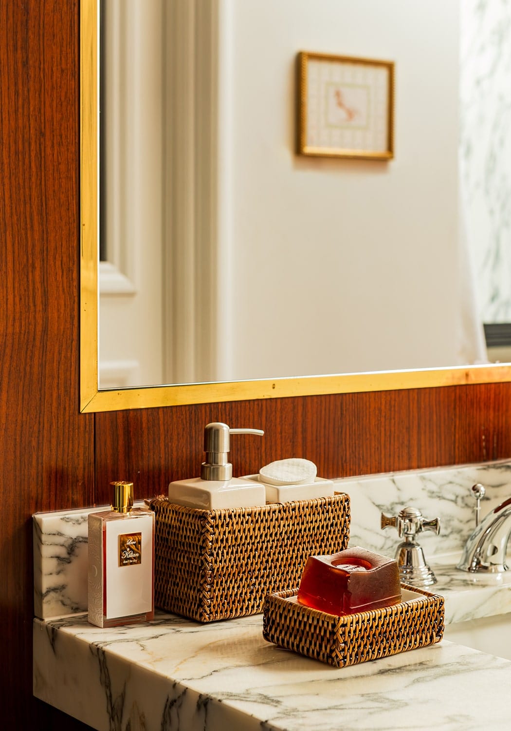 Wicker rattan bathroom accessories set by Casa, including a wash basin and storage basket, in natural woven design.