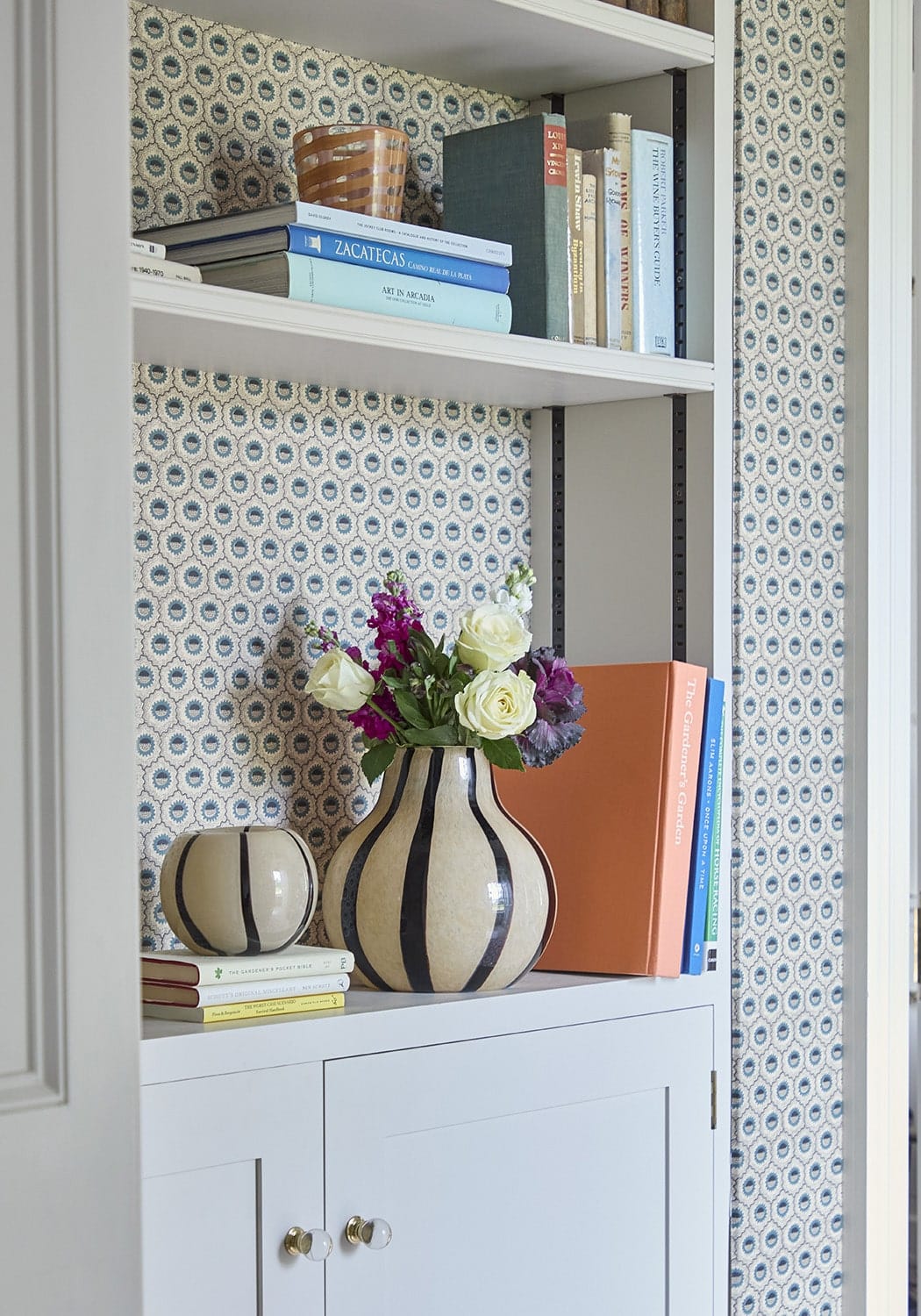 Casa by Josephine Jenno rounded striped two-toned brown vase with a smooth, curved design and horizontal pattern.