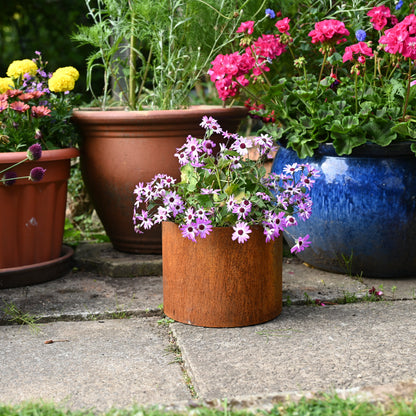 Rusty garden plant pots by savageworksuk with a weathered, rustic finish, perfect for outdoor garden planters.