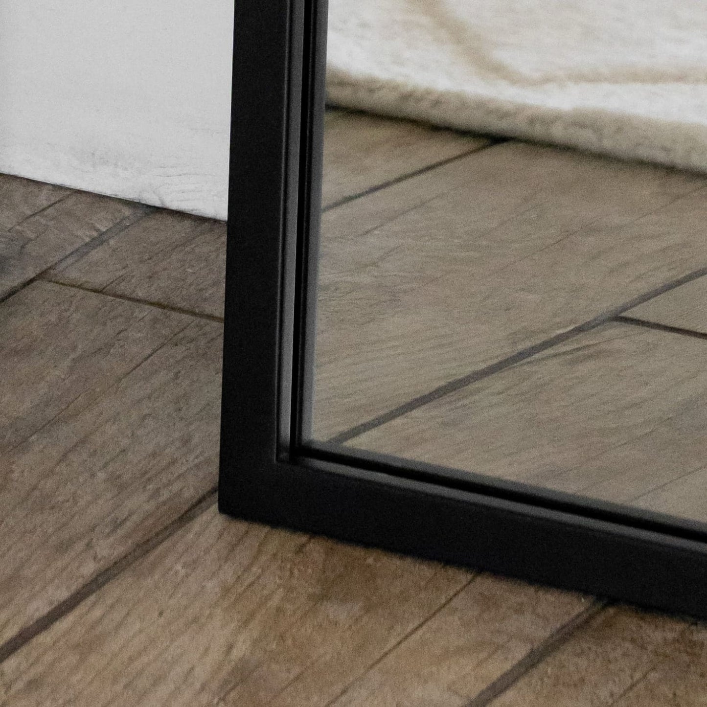 Full-length black metal rectangle mirror by Jōbū Home, 160cm x 60cm, reflecting a modern, sleek design for home decor.