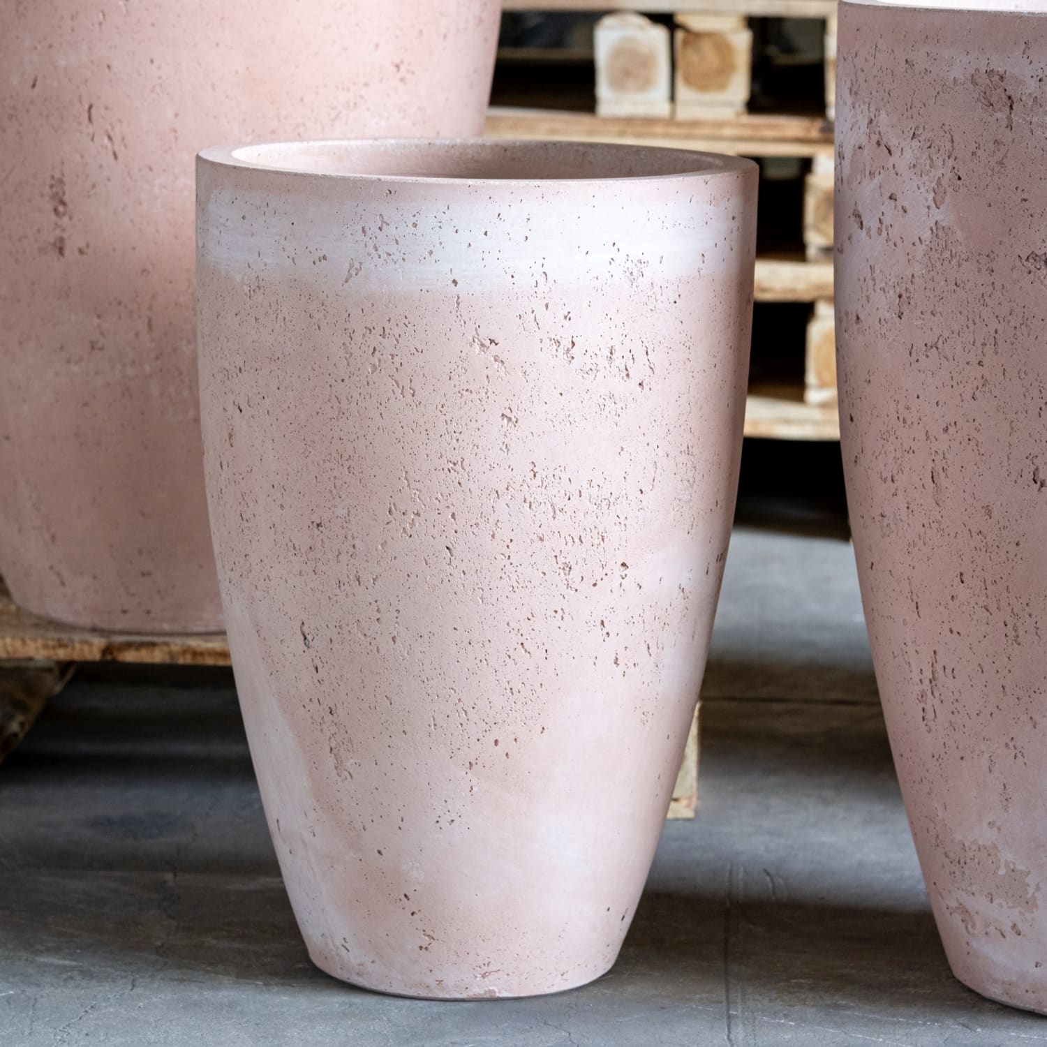 Vessara Blushstone 75cm large concrete vase planter with tall plant, 61L capacity, ideal for outdoor or indoor decorative plants.