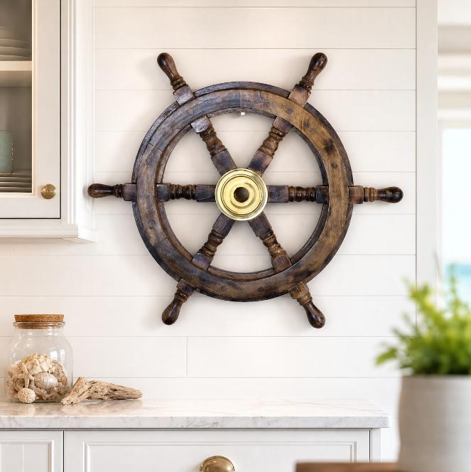 Naav wooden ships wheel ornament in natural wood finish, decorative nautical decor by Maravi for maritime-themed interior design.