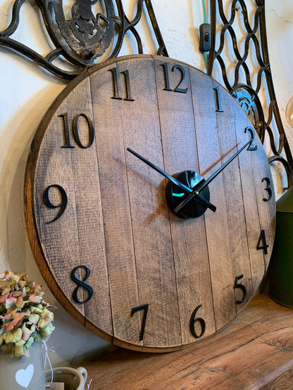 Oak finish whiskey barrel clock by MooBoo Home, made to order, featuring a rustic design with visible wood grain and vintage details.