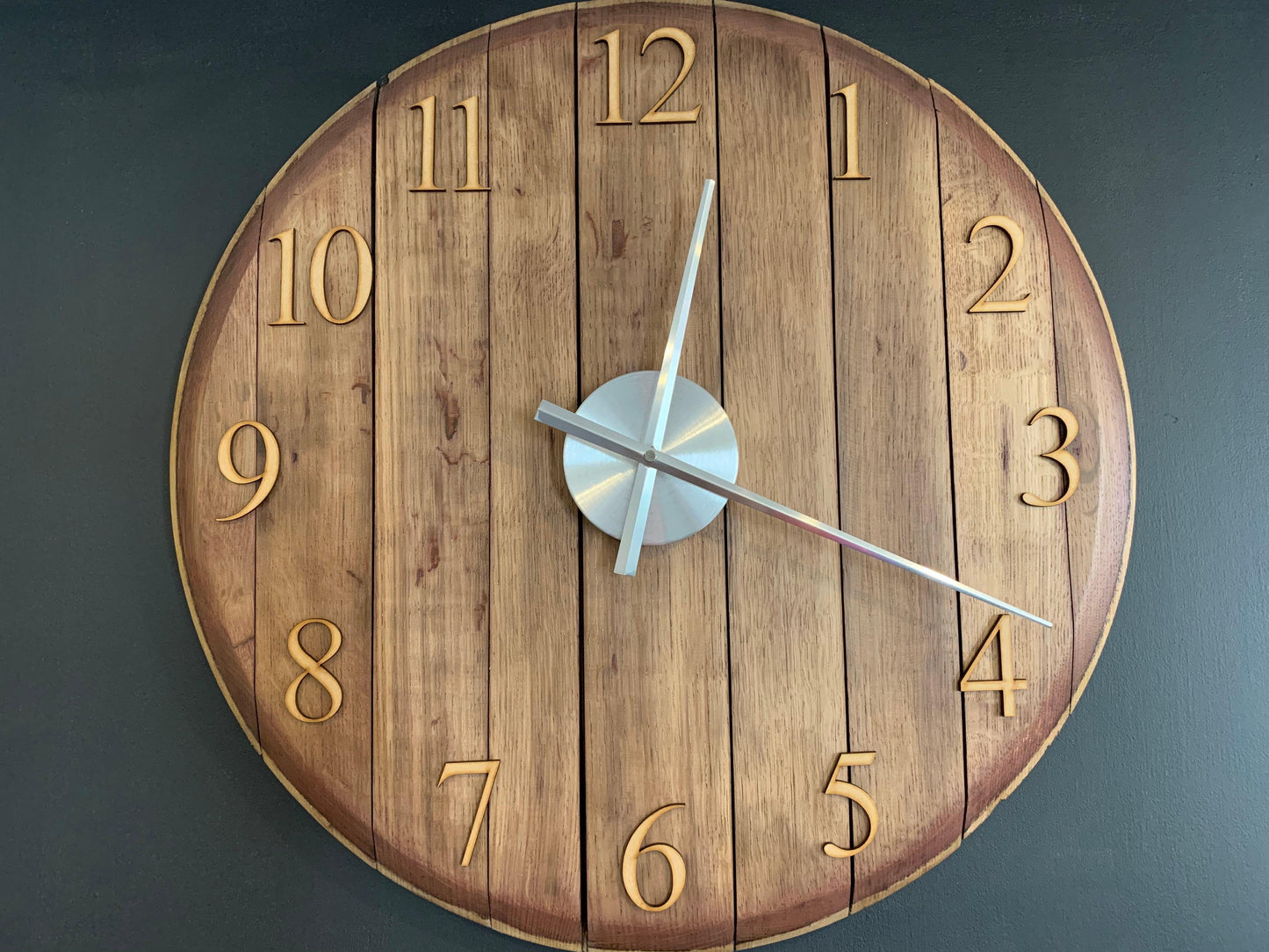 Oak finish whiskey barrel clock by MooBoo Home, featuring a rustic design with visible wood grain and vintage-style clock face.
