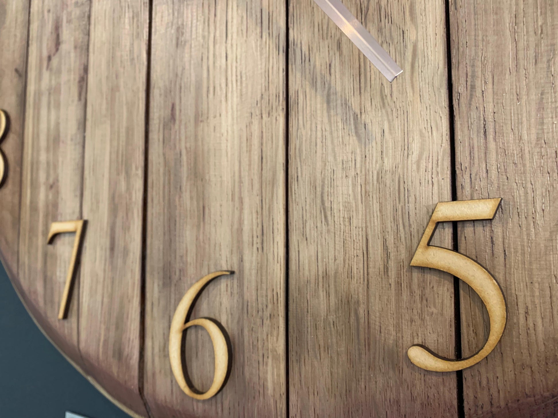 Oak finish whiskey barrel clock by MooBoo Home, made to order, featuring rustic wood grain and vintage-style clock face.
